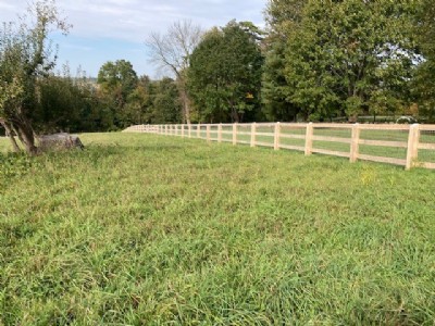 Cedar wood fencing in the middle of a field